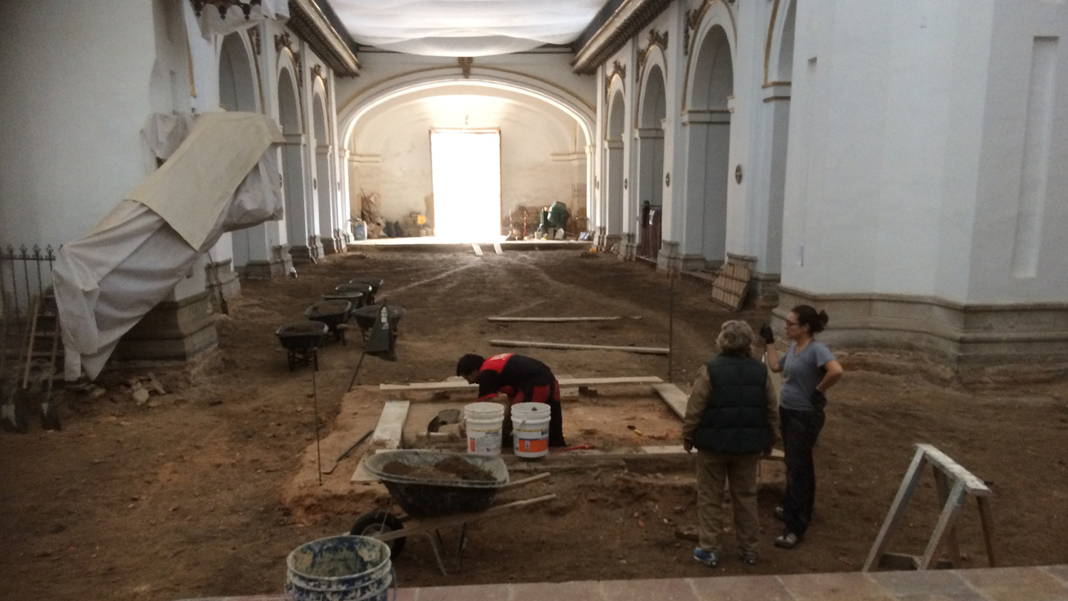 San Ignacio Archaeology Project members excavate in the nave of the church