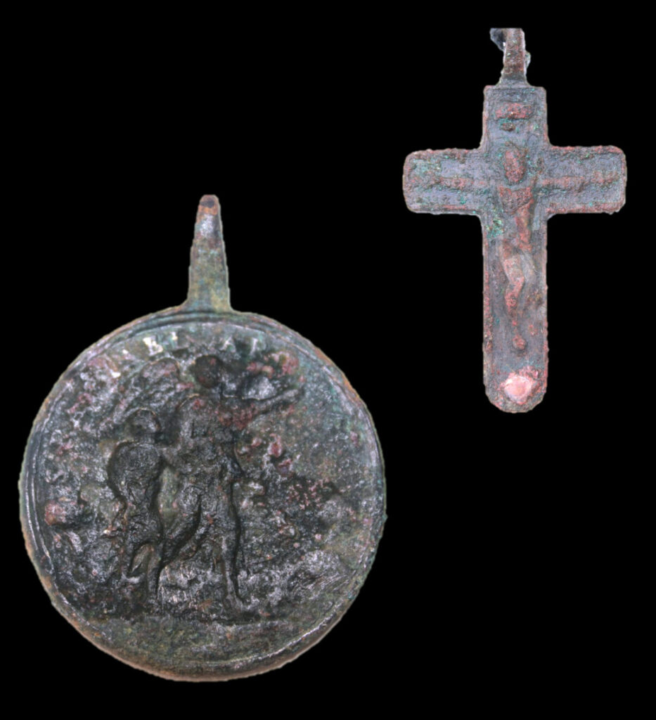 metal medallions and a metal cross excavated from San Ignacio