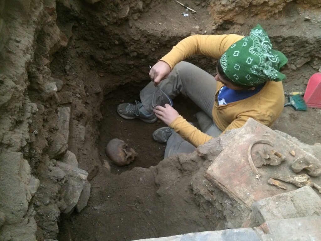 San Ignacio Archaeological Project Co-Director Julie K. Wesp is excavating human skeletal remains from the Presbytery