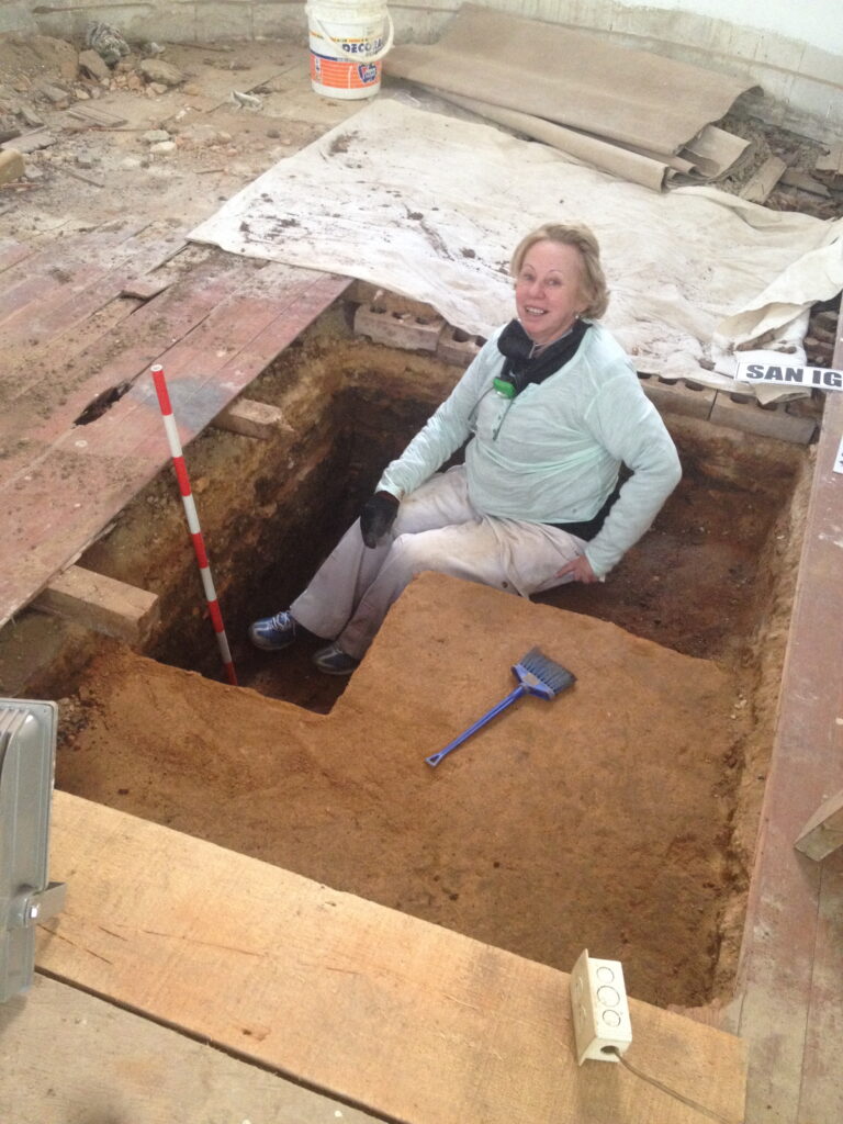 Elena Uprimny sitting in an excavation unit