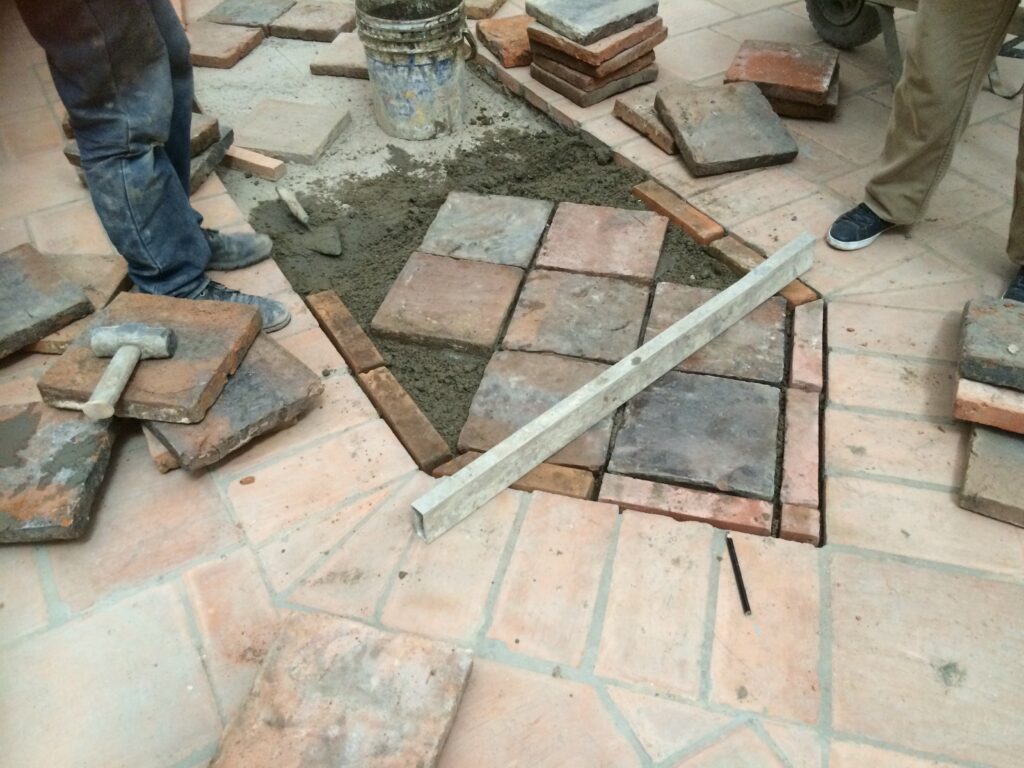 Tiles from the old floor exposed during excavations were reused in the new floor at San Ignacio